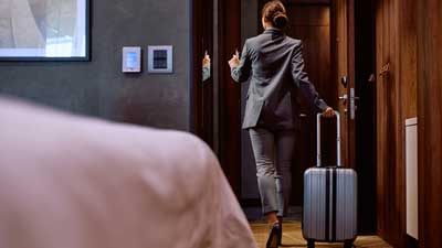 woman checking out of hotel room