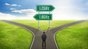 Road splitting with 1.2 and 1.8GHz signs pointing to the two paths