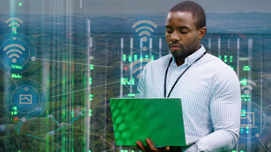 Man in business center on laptop