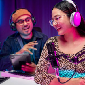 Two people talking during a radio broadcast