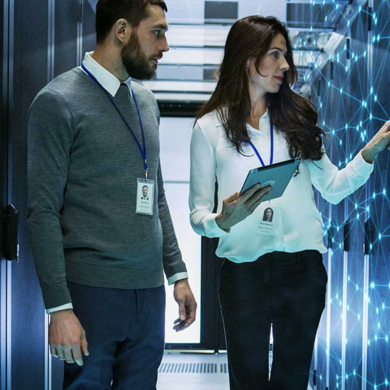 Man and woman talking in  a data center